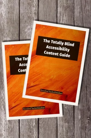 The Totally Blind Accessibility Content Guide on a wooden surface